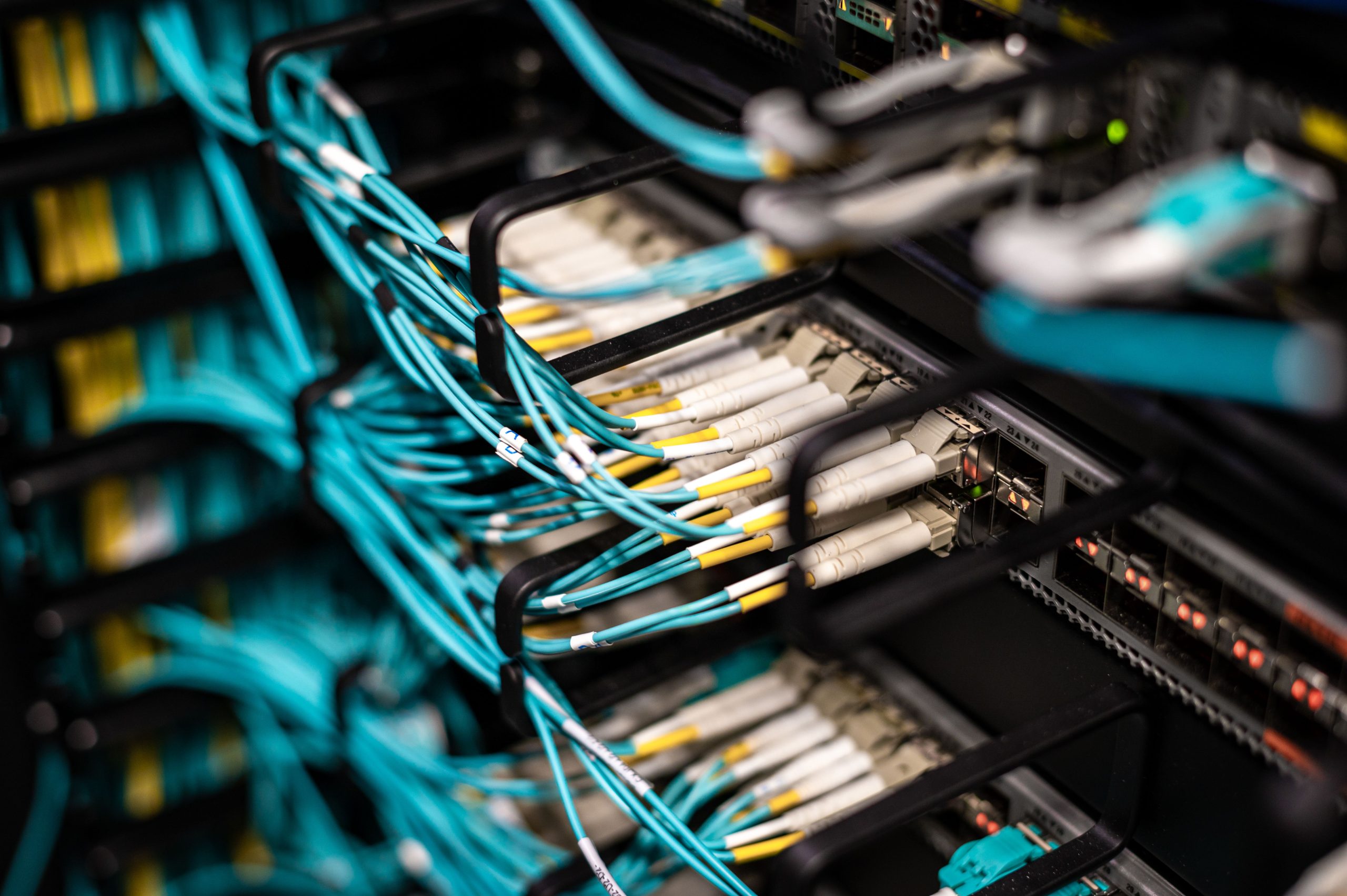 Numerous wires and cables mounted into server patch panel in modern data center
